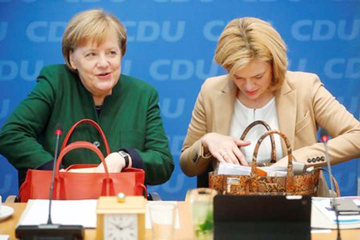 Acting Chancellor Angela Merkel and deputy leader of Christian Democratic Union Julia Kloeckner attend a party meeting at the Christian Democratic Union (CDU) headquarters in Berlin, Germany, on Monday.