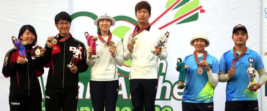 The winners of the Asian Archery Championship pose for photo at the Bangabandhu National Stadium on Tuesday.