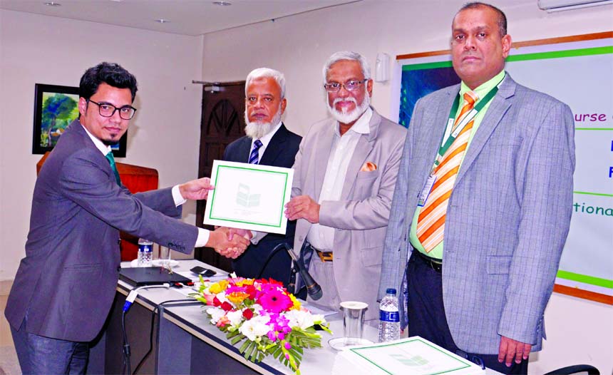 Shah Syed Abdul Bari, DMD of National Bank Limited, handing over the certificates among the participants of 11-day long "Foreign Exchange Risk Management and Financing in International Trade" at the bank's Training Institute in the city recently. Md. H