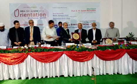 Prof KM Golam Mohiuddin, Vice Chancellor, International Islamic University, Chittagong handing over IIUC Enterprenarship Award 2017 to Nader Khan, Managing Director of Pedrllo Ltd and Mohammed Humayun Kabir, Executive Director, Bangladesh Bank, Chittag