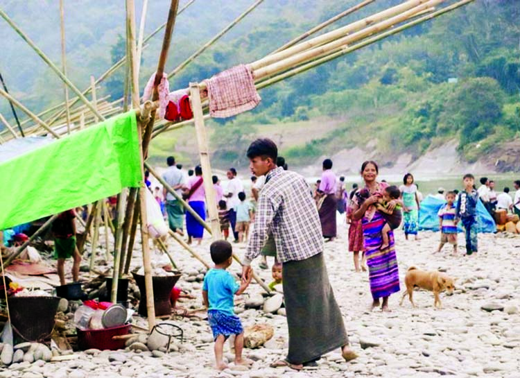 Some of the displaced Paleta villagers set up camp near a river along the India-Myanmar border to escape fighting between Myanmar army and AA.