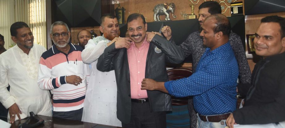 CCC Mayor A J M Nasir Uddin wearing blazer with CCC monogram at his office on Wednesday. Among others, Councilors Ismail Bali, H M Sohel, Shailbal Das Sumon, Shaheed Iqbal Babu and M Ashraful Alam were present .