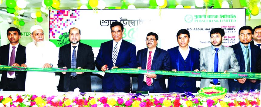 Md. Abdul Halim Chowdhury, Managing Director of Pubali Bank Limited, inaugurating its 459th branch at Chandina in Comilla recently. Mohammad Ali, DMD, Sukanta Chandra Banik, DGM and RM of Comilla Region of the bank and local elites were also present.