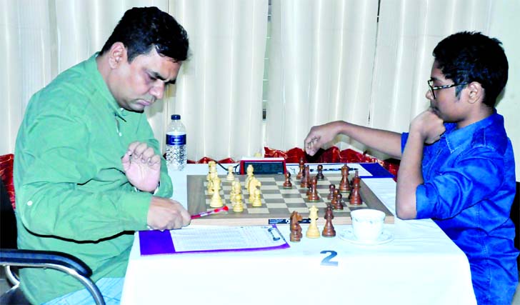 GM Ziaur Rahman (left) in action against FIDE Master Fahad Rahman in the ninth round match of the 43rd National A Chess Championship held at Bangladesh Chess Federation hall-room on Friday.
