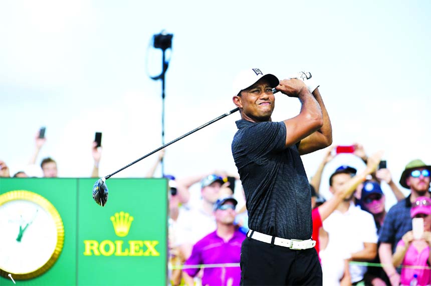 Tiger Woods tees off on the first hole at the Hero World Challenge golf tournament at Albany Golf Club in Nassau, Bahamas on Thursday.