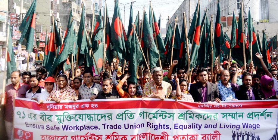 Garments employees organised a flag rally in the city's Topkhana Road on Friday honouring freedom fighters of 1971.
