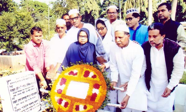 Newly elected President of Jatiya Ganotantrik Party Prof Rehana Prodhan along with party leaders and activists placing floral wreaths at the grave of founding president of the party late Shafiul Alam Prodhan in the city's Banani Graveyard on Friday.