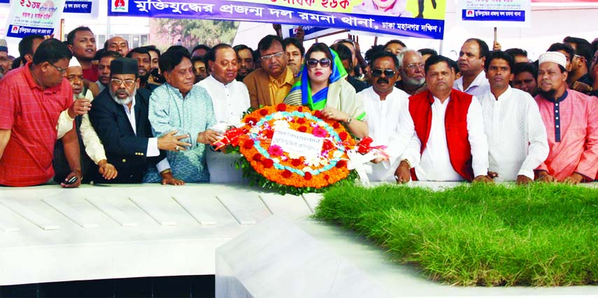 BNP Standing Committee Member Barrister Moudud Ahmed along with the leaders and activists of Muktijuddher Projanmo Dal placing floral wreaths on the Mazar of Shaheed President Ziaur Rahman on Friday marking founding anniversary of Projanmo Dal.