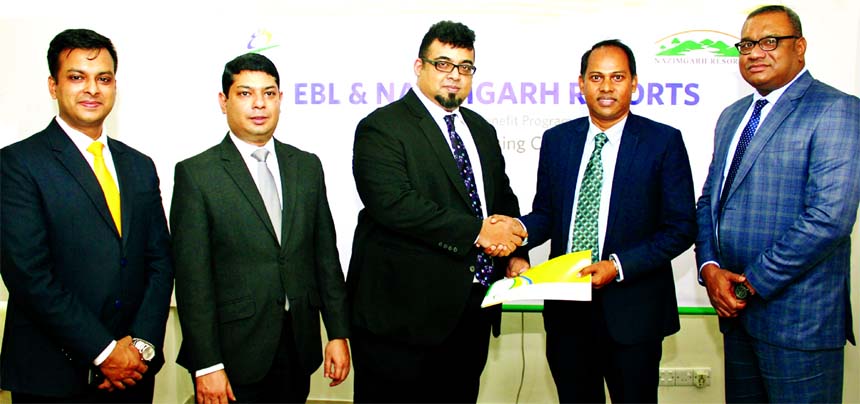 M Nazeem A Choudhury, Head of Consumer Banking of EBL and Khairul Anam, General Manager (Sales and Marketing) of Nazimgarh Resorts, exchanging an agreement signing documents at the bank in the city recently. Under the deal, card members of the bank will e