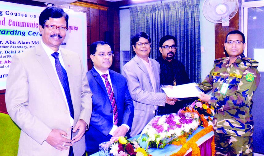 Major Khalid Bin Ismot Biplob of Bangladesh Army receiving certificate at the certificate awarding ceremony of a training course on 'Public Relations, Media and Communication Techniques' organised recently by Bangladesh Institute of Journalism and Ele