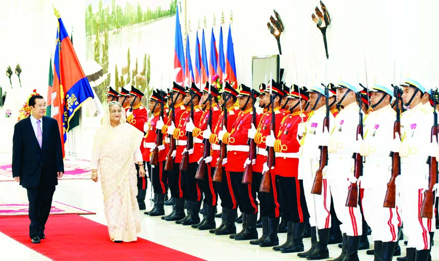 Prime Minister Sheikh Hasina being given guard of honour when she reached the office of her Cambodian counterpart Hun Sen at Phnom Penh on Monday. Hun Sen was also present on the occasion. BSS photo