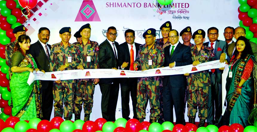 Major General Abul Hossain, Director General of Border Guards Bangladesh and Chairman of Shimanto Bank Limited, inaugurating its 6th branch at Motijheel in the city on Wednesday. Muklesur Rahman, Managing Director, other Directors and senior officials of