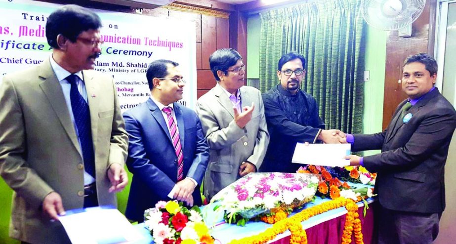 Former Secretary of the LGRD Ministry Abu Md Shahid Khan distributing certificates among the participants at a training course on 'Public Relations, Media and Communication Techniques' organised recently by Bangladesh Institute of Journalism and Electr