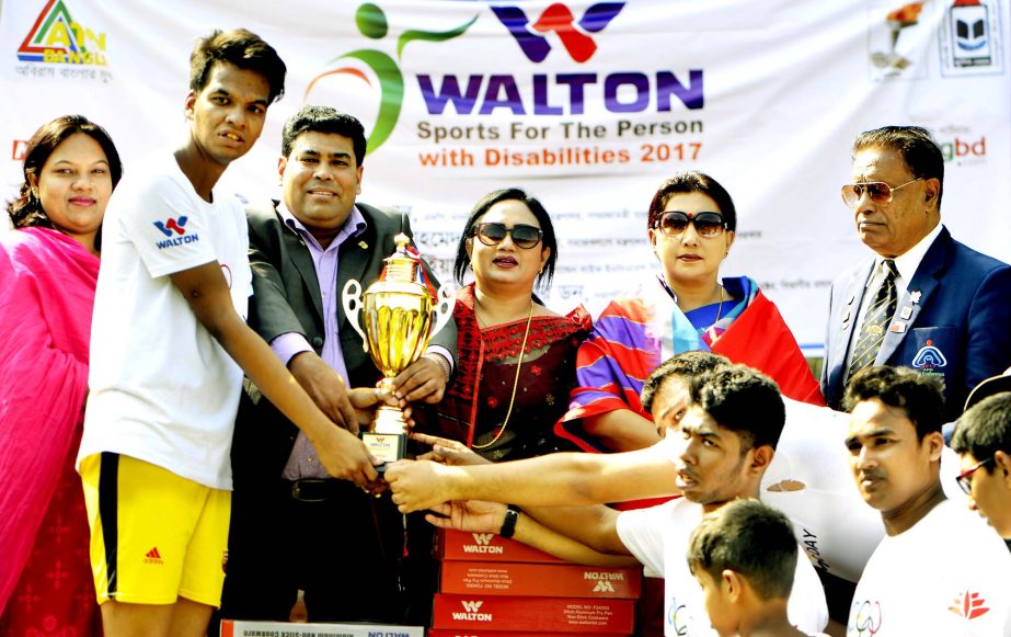 Members of National Association of Sports for Persons with Disabilities (NASPD) team, the winners of the football match of the Children with Special Needs with the guests and officials of NASPD pose for a photo session at the Sultana Kamal National Women