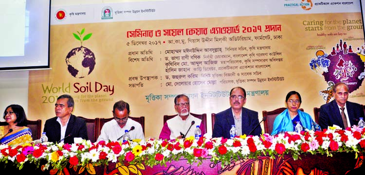 Senior Secretary of the Agriculture Ministry Mohammad Moinuddin Abdullah, among others, at a seminar and award distribution ceremony organised on the occasion of World Soil Day by Soil Resources Development Institute in the city's Khamarbari on Tuesday.