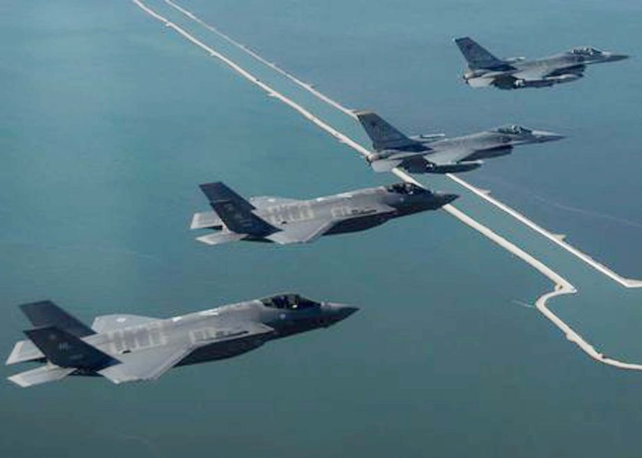 US Air Force F-16 Fighting Falcon and F-35 Lightning II aircraft participate in a training mission near Kunsan Air Base, South Korea.