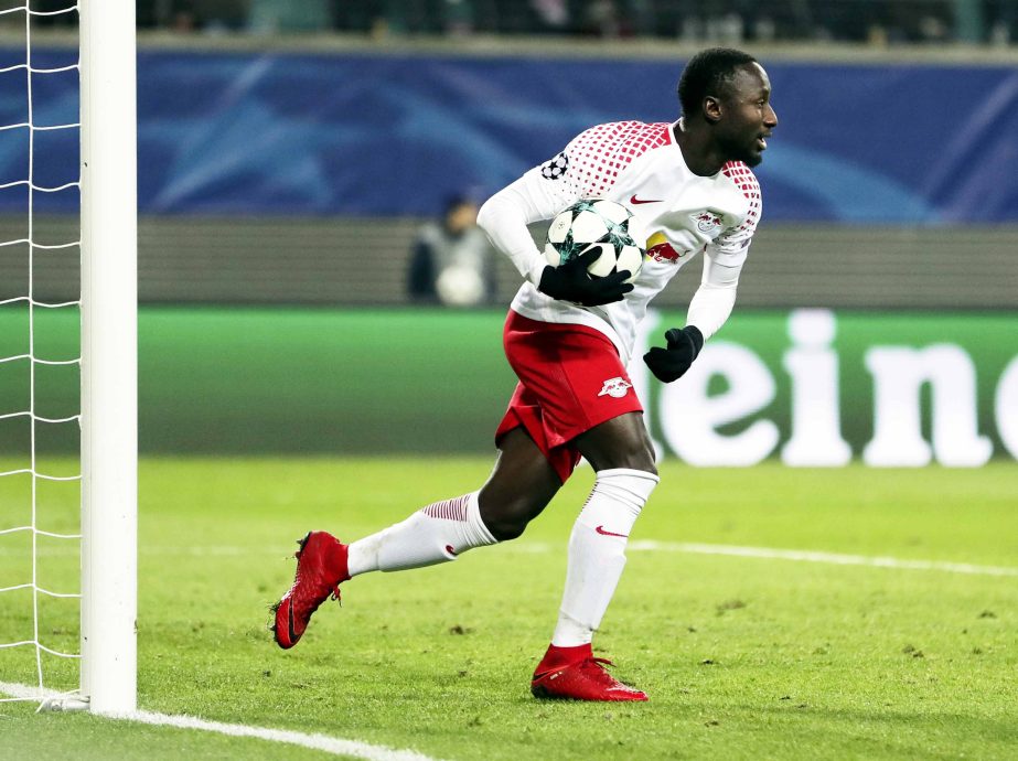 Leipzig's Naby Keita grabs the ball after scoring his side's first goal during the Champions League Group G soccer match between RB Leipzig and Besiktas JK in Leipzig, Germany on Wednesday.