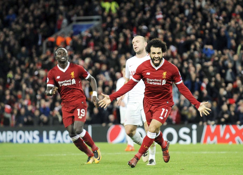 Liverpool's Mohamed Salah (right) celebrates after scoring his side's seventh goal during the Champions League Group E soccer match between Liverpool and Spartak Moscow at Anfield, Liverpool, England on Wednesday.