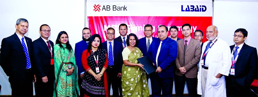 Shamshia I Mutasim, DMD of AB Bank Limited and Al Emran Chowdhury, Chief Operating Officer of Labaid Hospitals, exchanging an agreement signing documents at the bank's head office in the city on Sunday. Under the deal, employees' and their dependents (s