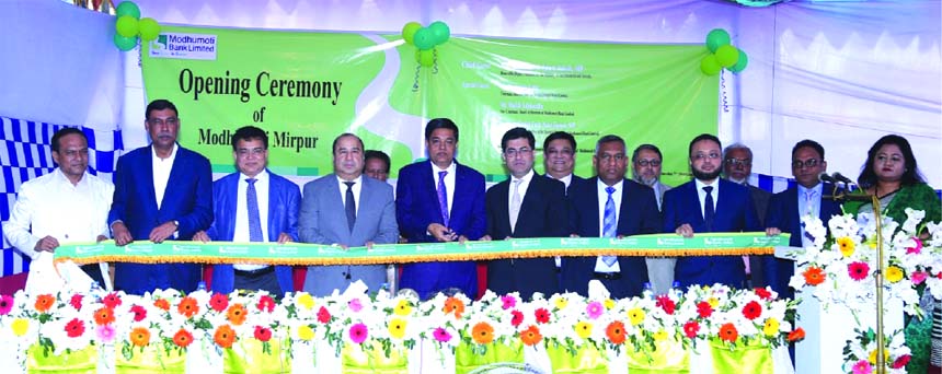 Deputy Minister for Environment and Forests Abdullah Al Islam Jakob, inaugurating the 27th Branch of Modhumoti Bank Limited at city's Mirpur area on Thursday. Humayun Kabir, Chairman of Board of Directors, Barrister Sheikh Fazle Noor Taposh, EC Chairman