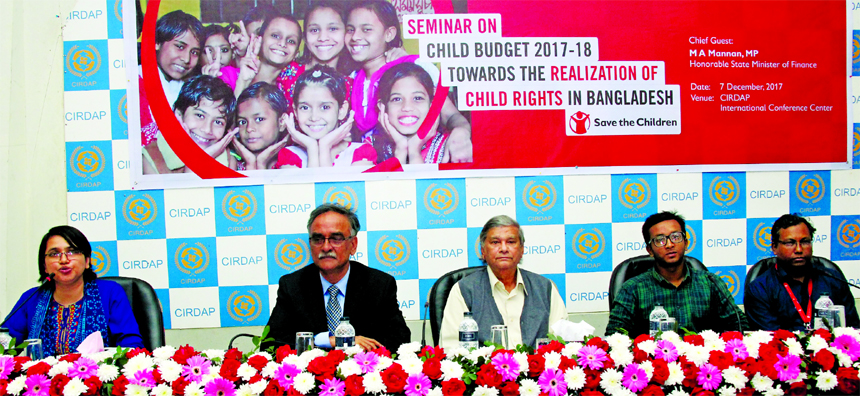State Minister for Finance MA Mannan, presiding over a seminar on "Child Budget: Realisation towards the Child Rights in Bangladesh" organized by Save the Children in Bangladesh (SCB) at CIRDAP auditorium in the city on Thursday. Finance Department acti