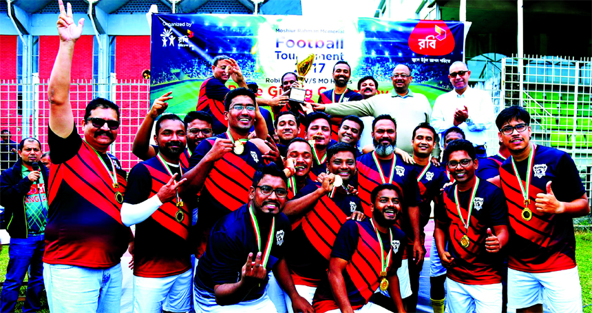 Market Operations Heroes of Robi, the champions of the Moshiur Rahman Memorial Football Tournament with the high officials of Robi pose for a photo session at Sylhet District Stadium on Friday. Market Operations Heroes of Robi beat Robi United by 3-0 goal