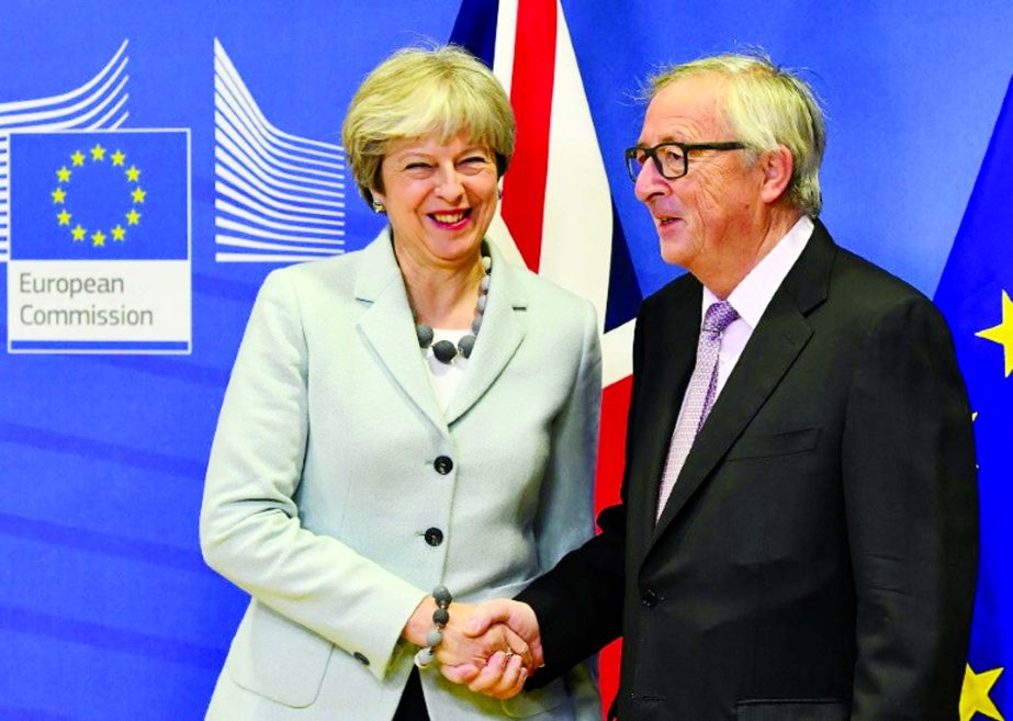 Theresa May and EU chief Jean-Claude Juncker reached a historic deal on Brexit divorce terms.
