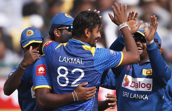 Sri Lanka's Suranga Lakmal (third left) celebrates with teammates the dismissal of India's captain Rohit Sharma during their first one-day international cricket match in Dharmsala, India on Sunday.