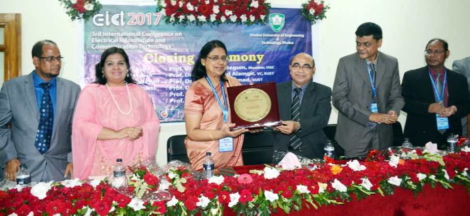 Prof Dr Dil Afroza Begum, Member, UGC receives a 'Crest of Honour' from Prof Dr Muhammad Alamgir, Vice Chancellor of Khulna University of Engineering and Technology at the 3rd International Conference on Electrical Information and Communication Technolo