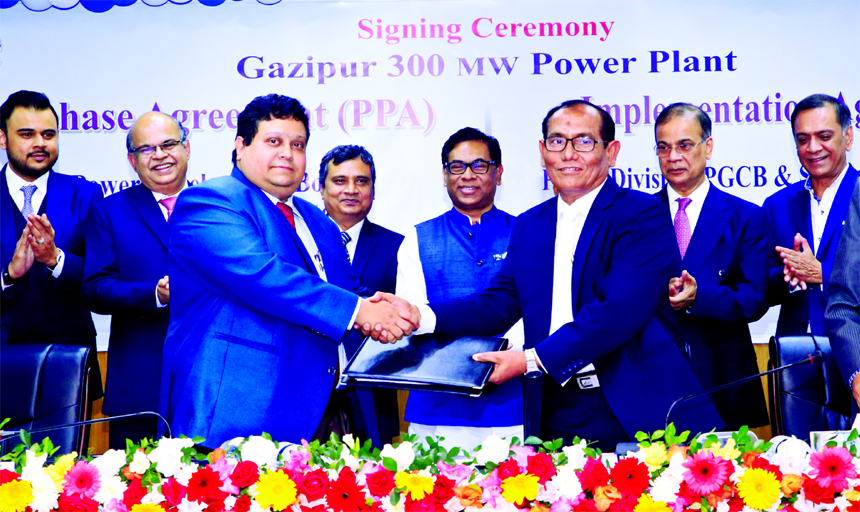 Mina Masuduzzaman, Secretary of Bangladesh Power Development Board and Engineer Md. Mozammel Hossain, Managing Director of Summit Gazipur-II power Ltd, exchanging a signing documents of signed 300MW power generation and power purchase deals at Bidyut Bha