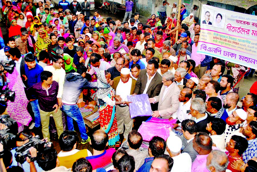 BNP Secretary General Mirza Fakhrul Islam Alamgir distributing winter clothes among the cold-hit people in the city on Monday. BNP Dhaka Mahanagar Dakshin organised the programme.