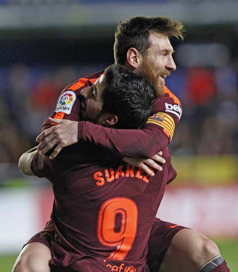 Barcelona's Lionel Messi celebrates after scoring against Villarreal during the Spanish La Liga soccer match between Villarreal and FC Barcelona at the Ceramica stadium in Villarreal, Spain on Sunday.