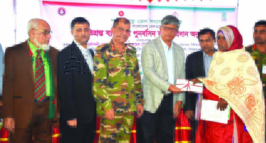 Engr. Golam Fakhruddin Ahmed Chowdhury, Additional Secretary and Project Director of Padma Bridge Rail Link Project, handing over cheque among the people who are affected for Rail Road construction of the bridge at Pagla in Narayangonj on Tuesday. Banglad