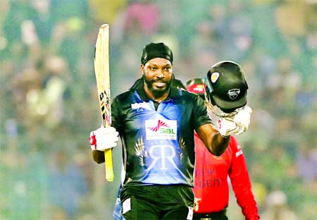 Chris Gayle of Rangpur Riders celebrates his century during the final match of the AKS Bangladesh Premier League (BPL) Twenty20 Cricket between Rangpur Riders and Dhaka Dynamites at the flood-lit Sher-e-Bangla National Cricket Stadium in the city's Mirpu