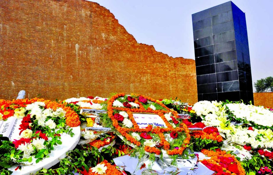 Marking the Martyred Intellectuals Day, the people from all walks of life placed floral wreaths at the 'Rayerbazar Killing Ground' on Thursday.