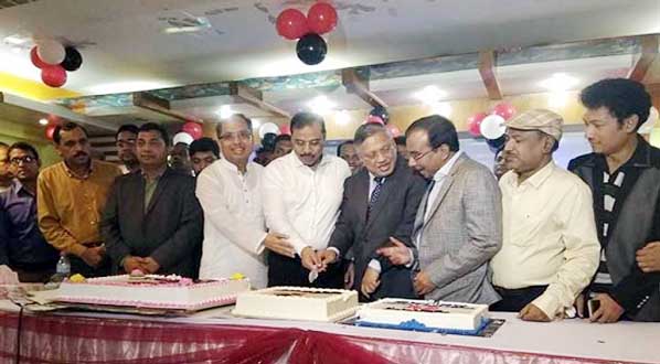 A view of the cake cutting in observance of entering 6th year of publication of Daily Purbodesh.