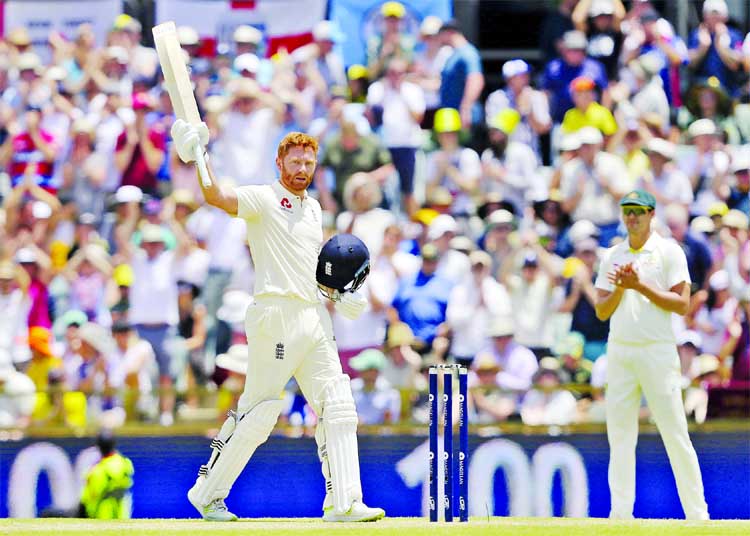 England's Jonny Bairstow celebrates scoring 100 runs against Australia during the second day of their Ashes cricket Test match in Perth, Australia on Friday.