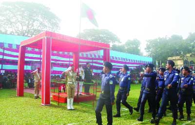 GOURIPUR (Mymensingh): Nazim Uddin Ahmed MP taking salute of a march past at Gouripur Stadium marking the Victory Day on Saturday.