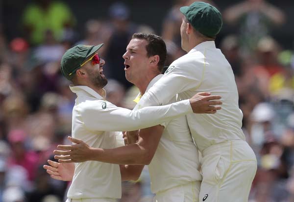 Australia's Josh Hazlewood (center) celebrates with the teammates after dismissing England's Alastair Cook during the fourth day of their Ashes cricket Test match in Perth, Australia on Sunday.