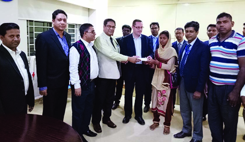 Noted Audiologist Dr Anirban Dasgupta, among others, at hearing aid distribution among hearing impaired people organised recently at Asgar Ali Hospital.