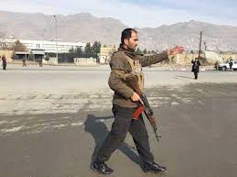 Afghan security personnel arrive at the site of complex attack at an intelligence training center in Kabul.