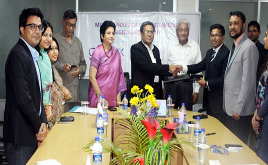 Prof Dr ANM Meshquat Uddin, Vice Chancellor of Southeast University and Md. Mostofa Jaman, Head of Training and Development, Genex Infosys Ltd shake hands after signing a MoU at the Conference Room of the University at Banani in the capital on Wednesday.