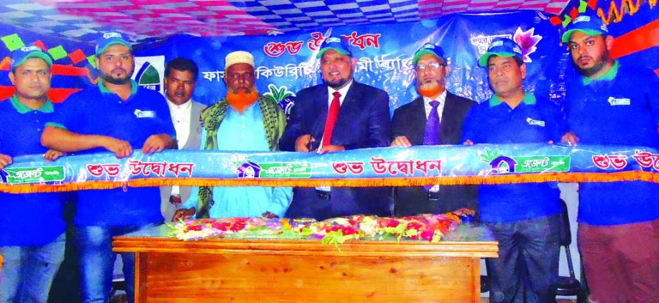 Md. Mustafa Khair, DMD of First Security Islami Bank Limited, inaugurating its Agent Banking outlet at Bharpur Bazar of Baliakandi in Rajbari on Thursday. Md. Faridur Rahman Jalal, FVP of Agent & Mobile Banking and Mohammad Ziaur Rahman, Manager of Faridp