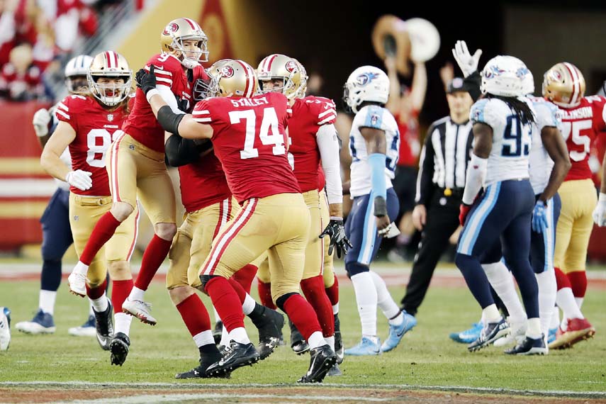 San Francisco 49ers kicker Robbie Gould (9) is lifted by teammates after kicking the game-winning field goal during the fourth quarter of an NFL football game against the Tennessee Titans in Santa Clara, Calif on Sunday.