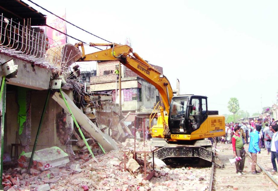 KHULNA: Bangladesh Railway ( BR) authorities in Khulna demolishing Illegal structures from both sides of rail tracks. This snap was taken from Daulatpur Bazar area yesterday.