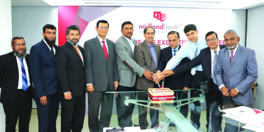 Rezaul Karim, Chairman of Midland Bank Limited, celebrating its 100th EC meeting at the bank's head office on Monday. Md. Ahsan-uz Zaman, Managing Director of the bank was also present.