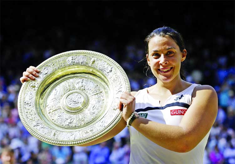 FILE - In this July 6, 2013, file photo Marion Bartoli, of France, smiles as she holds the trophy after winning the women's singles final match against Sabine Lisicki of Germany at the All England Lawn Tennis Championships in Wimbledon, London. Bartoli s