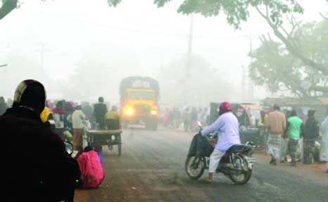 RAJSHAHI: Vehicle movement at Rajshahi city has been disrupted due to dense fog in the morning . This snap was taken from Chhorchhori Bazar in Bypass area on Wednesday.