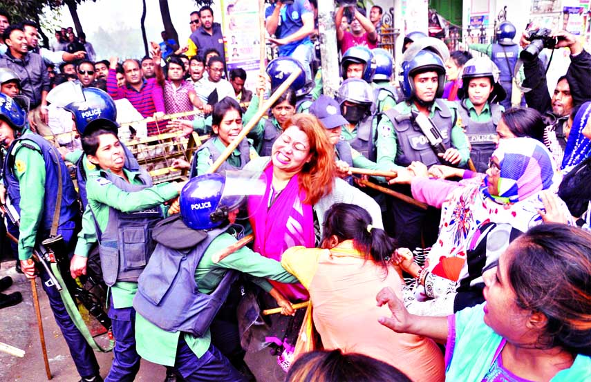 Police charge baton on the BNP women and other activists while they were trying to stage demonstration in front of High Court Mazar following Begum Khaleda Zia's appearance in the Bakshi Bazar special court for the 3rd day on Thursday.