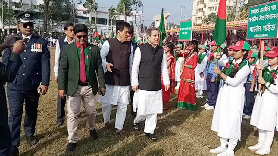 Chairman of the Parliamentary Standing Committee on Ministry of Railway ABM Fazle Karim Chowdhury MP visiting jubilant rally at Raozan Govt College ground arranged in observance of the Victory Day on Saturday evening. Upazila chairman and senior off